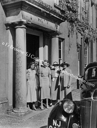 WALSINGHAM ABBEY GROUP AT DOORWAYS LADY GARNEY ON RIGHT MRS COWAN, LADY GARNERY'S DAUGHTER& SON IN LAW